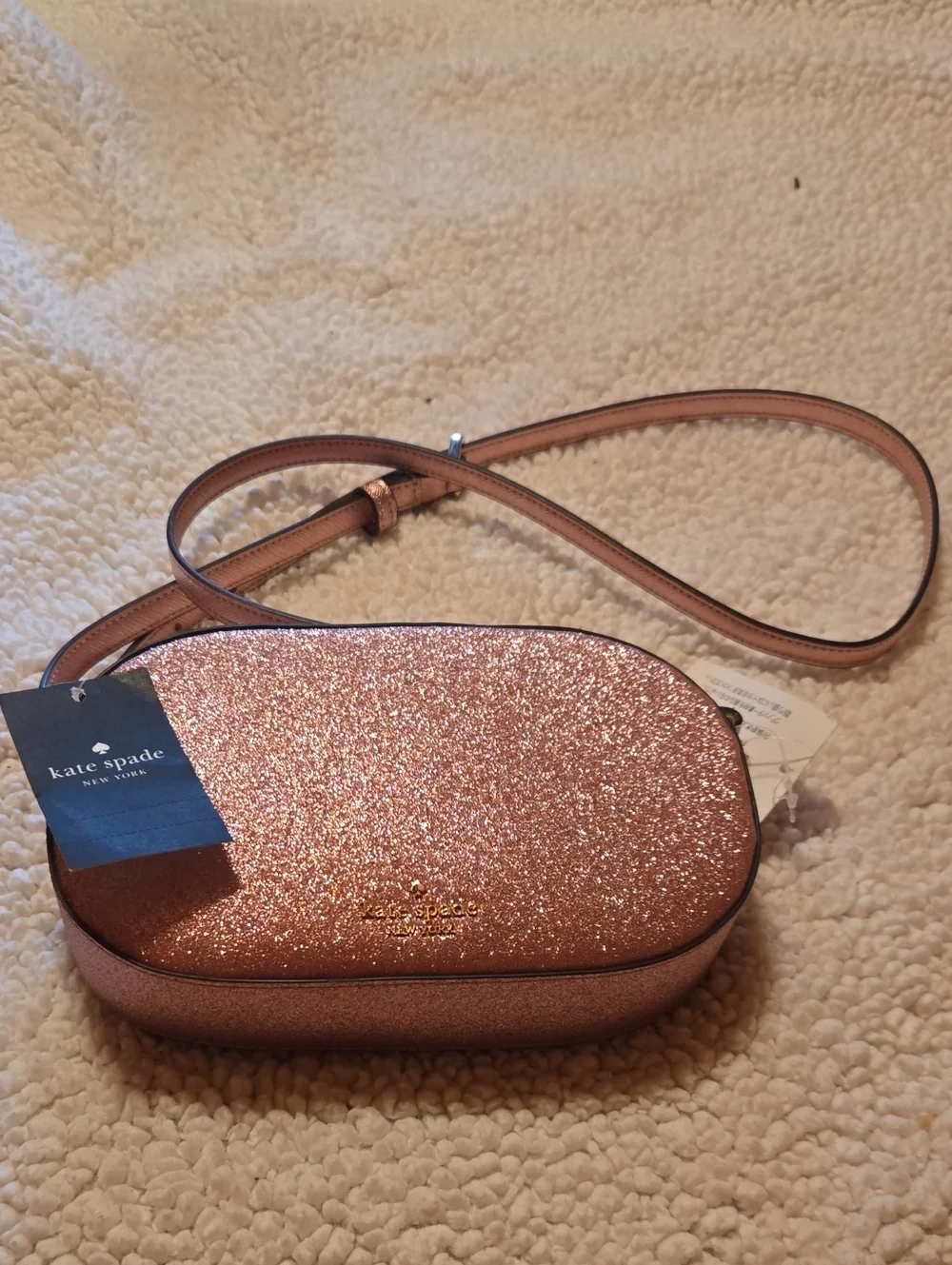 kate spade Rose Gold Glitter Oval Crossbody Bag